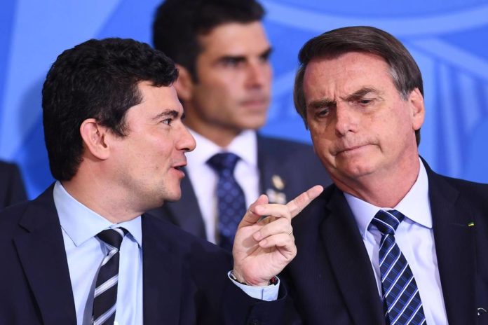 O ministro Sergio Moro e o presidente Jair Bolsonaro - Evaristo Sá/AFP