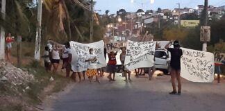 Moradores de comunidade fecham acesso a ponte e linha férrea em protesto após menino de 13 anos ser baleado em Natal